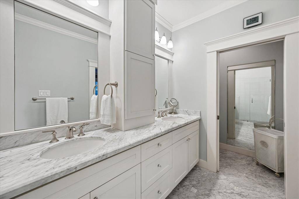 This angle shows the separate water closet with full-length mirror and a pocket door.  Not seen is the pocket door into the bathroom from the primary bedroom - a great space-saver and an often underutilized design element.  Walls were painted in October 2024.