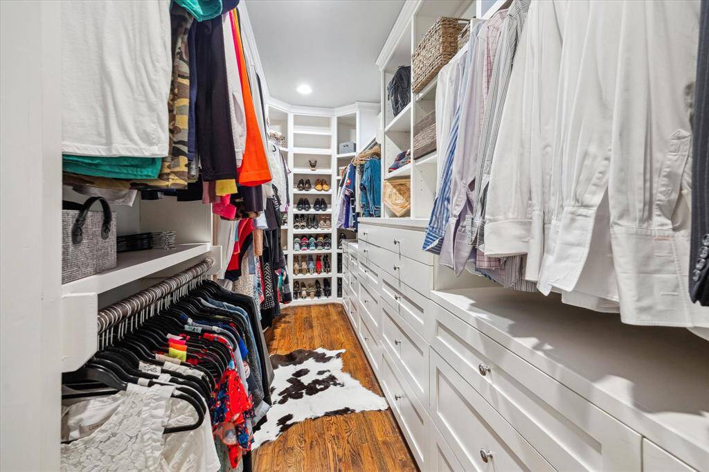 You don't see this in kind of closet in bungalows very often, measuring almost 16ft in length.  There are 22 built-in dresser drawers and 9 rods for hanging clothes.  You also have 9 shoe racks as well as two dozen shelves and cubbies for additional storage.