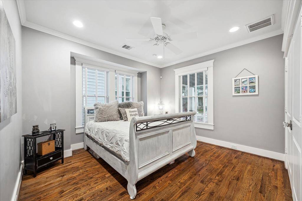 What a great guest bedroom.  It easily fits a queen bed and accompanying furniture.  Beautiful hardwood floors, crown molding, and a spacious closet complete this excellent room. Shiplap walls sit behind the sheetrock should you wish to expose them.