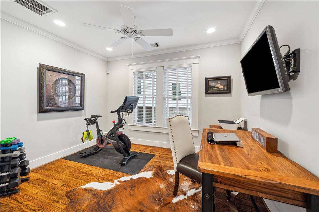 The third bedroom is used as an office/home gym.  The previous owners used this as their nursery.  Hardwood floors, crown molding, and recent paint (2024) round out this room.  Like the other bedroom, shiplap rests behind the sheetrock should you wish to expose them for that designer touch.