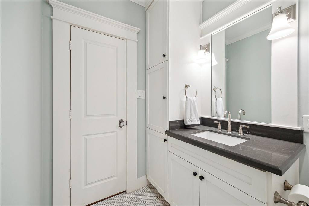 Another view of the guest bathroom and the deep storage cabinets to the side as well as under-sink storage.  Walls were painted in October 2024.