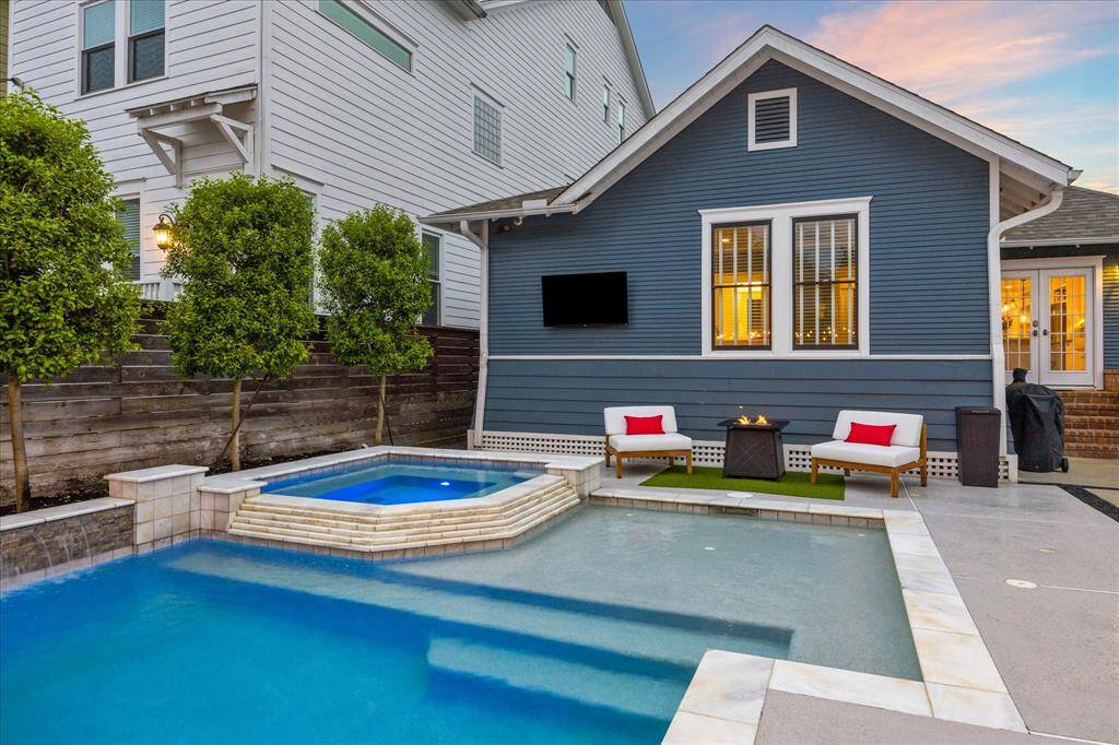 Enjoy hot-tubbing while watching your favorite movie or lounging on your tanning deck in the pool.  A classic pool design with a timeless elegance.