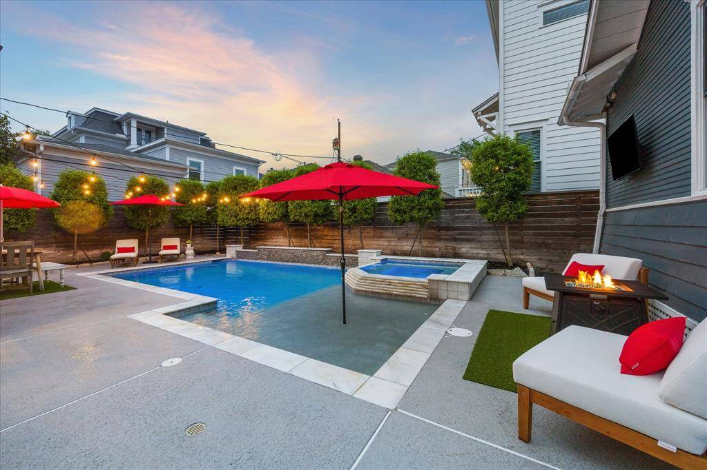 The tanning ledge has an umbrella holder for those days when the sun is a bit too much even when you are in the water.  Around the pool is a cool deck that keeps the ground much cooler than many other pool decking surfaces.