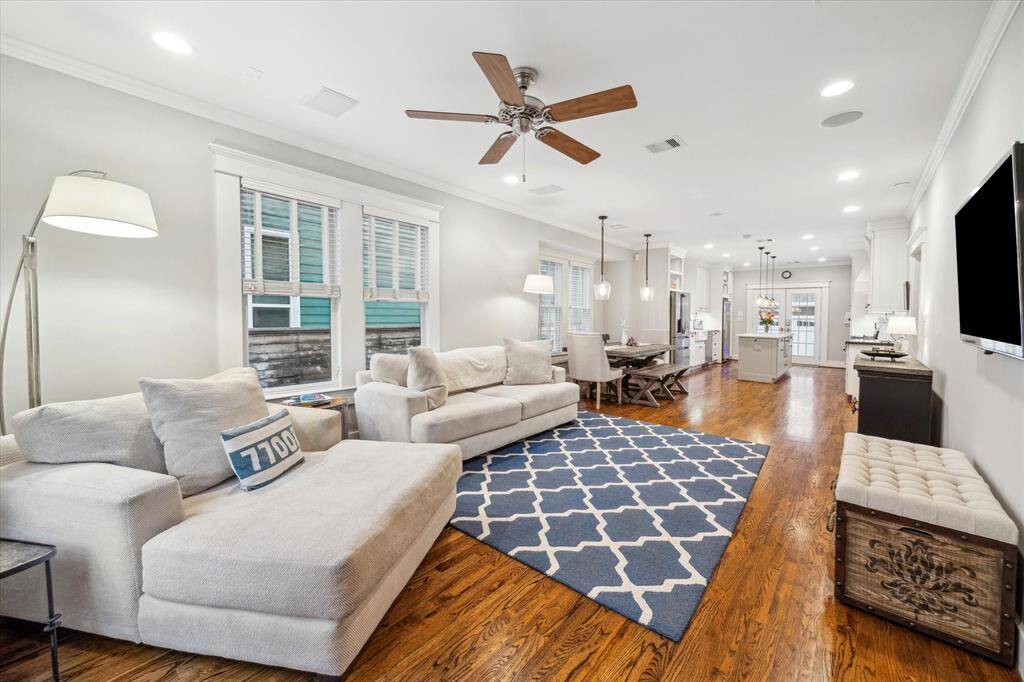 As you enter the home, notice the open floor plan yet clearly defined spaces.  The hardwood floors and crown molding run throughout the home.  The living room features in-ceiling speakers for that home theater sound. Walls were freshly painted in October 2024.