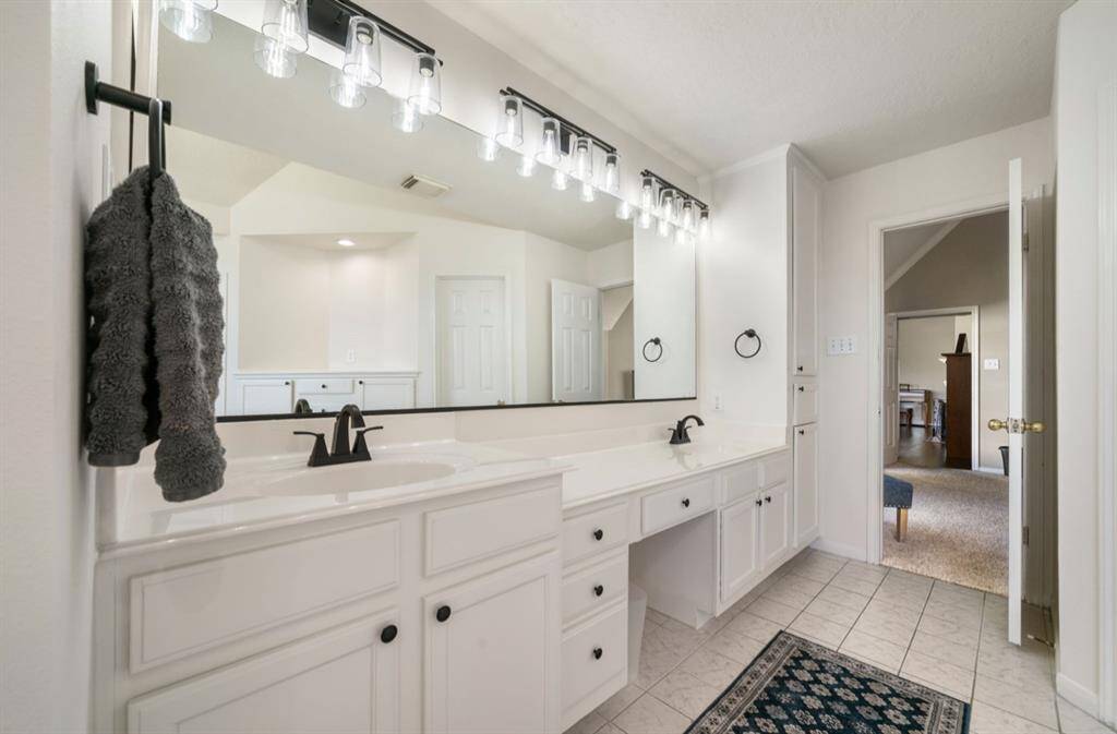 Your love unwinding in your primary bath retreat with large walk-in closets, soaking tub, and newly installed shower