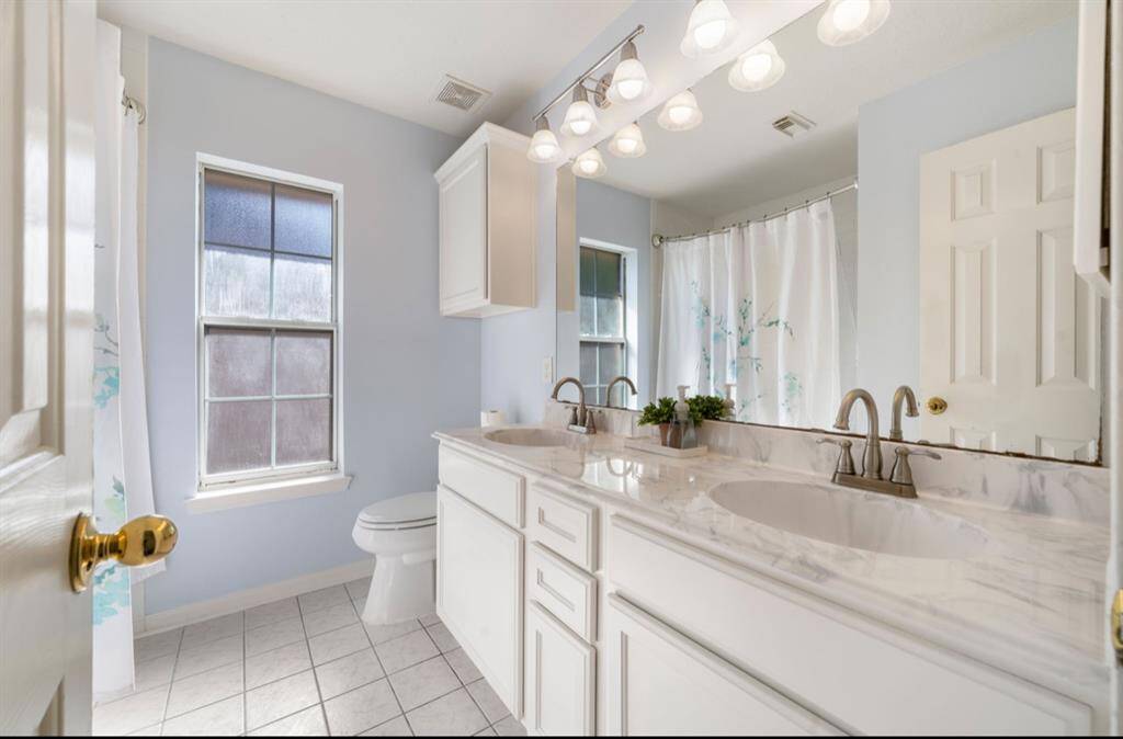 The secondary bathroom is equally charming and clean
