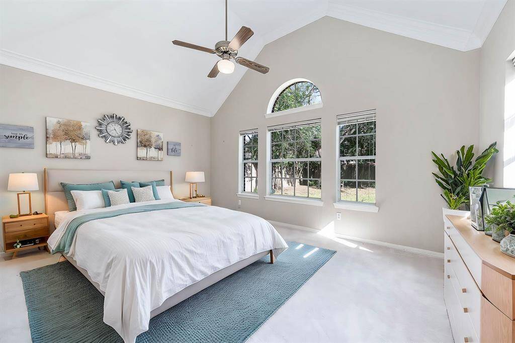This is a virtually staged photo with furniture in the master bedroom for demonstration purpose.