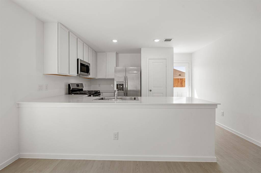 Check out the gorgeous kitchen with its large counterspace perfect for a breakfast bar.