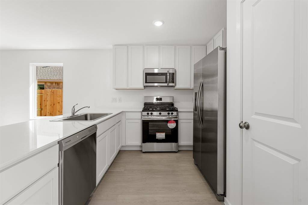 This fully equipped kitchen all new stainless steel appliances, cabinetry, and tons of cabinetry and counter space.