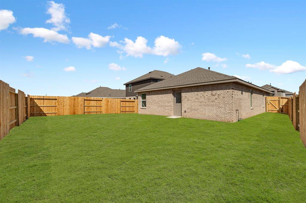 This HUGE backyard is definitely not lacking on green space.