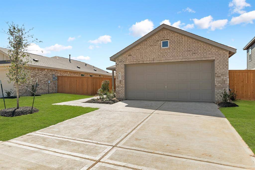 2-car garage with a long driveway.