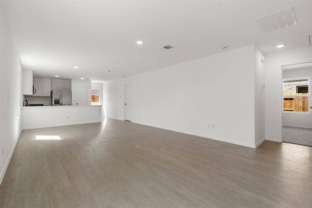 This fantastic open floor plan features vinyl plank floors, and recessed lighting.
