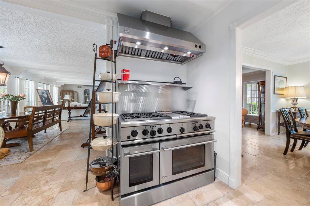 Additionally, indulge in the high-end GE Monogram gas range, complete with two more ovens for even more cooking versatility!