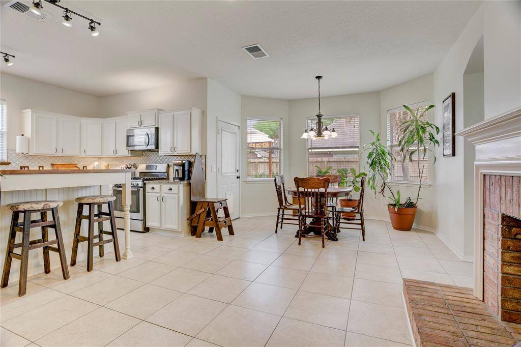 Huge kitchen with breakfast and bar seating is perfect for entertaining!