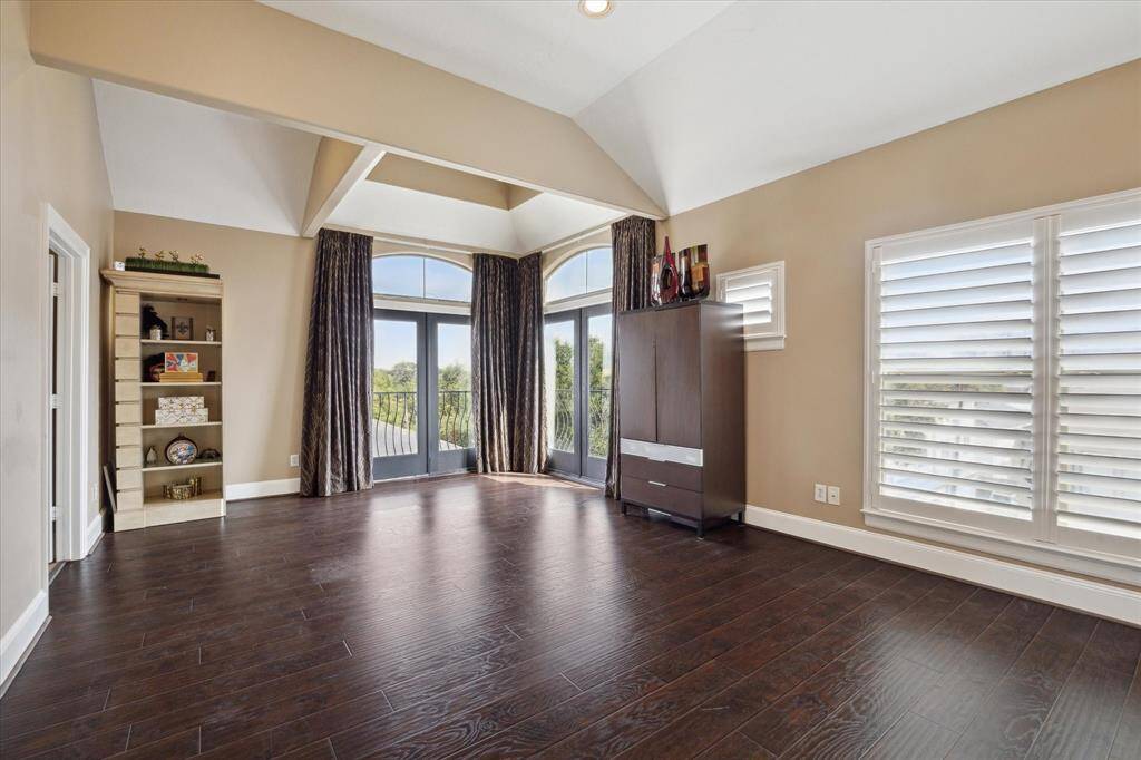 "Penthouse" Primary Bedroom overlooking green Camp Logan