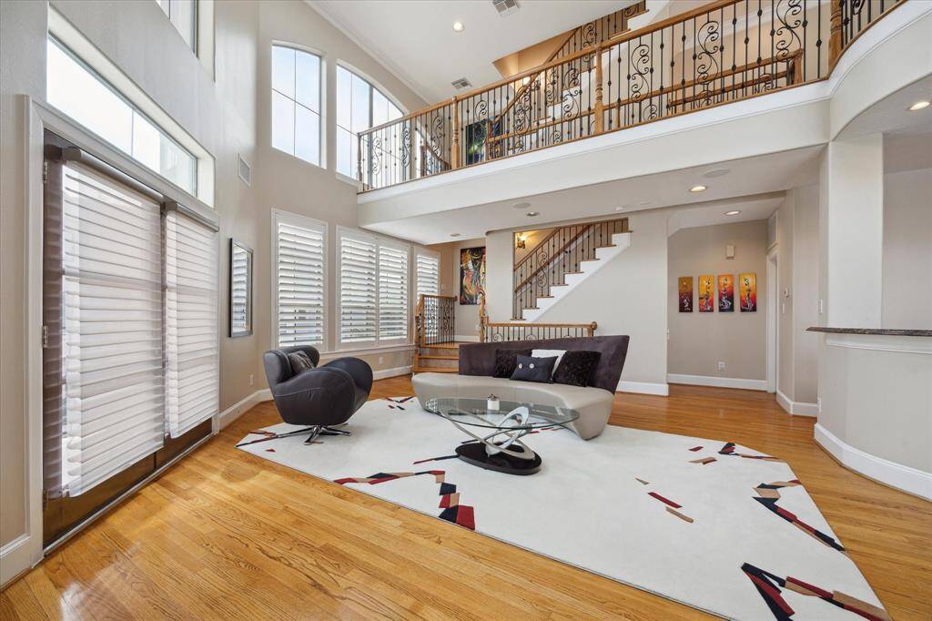 There is an abundance of natural light in this open Family Room with 20' ceilings