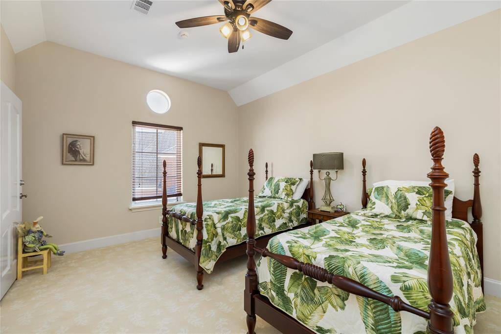 The secondary bedrooms provide generous space, offering comfortable retreats ideal for family members or guests.