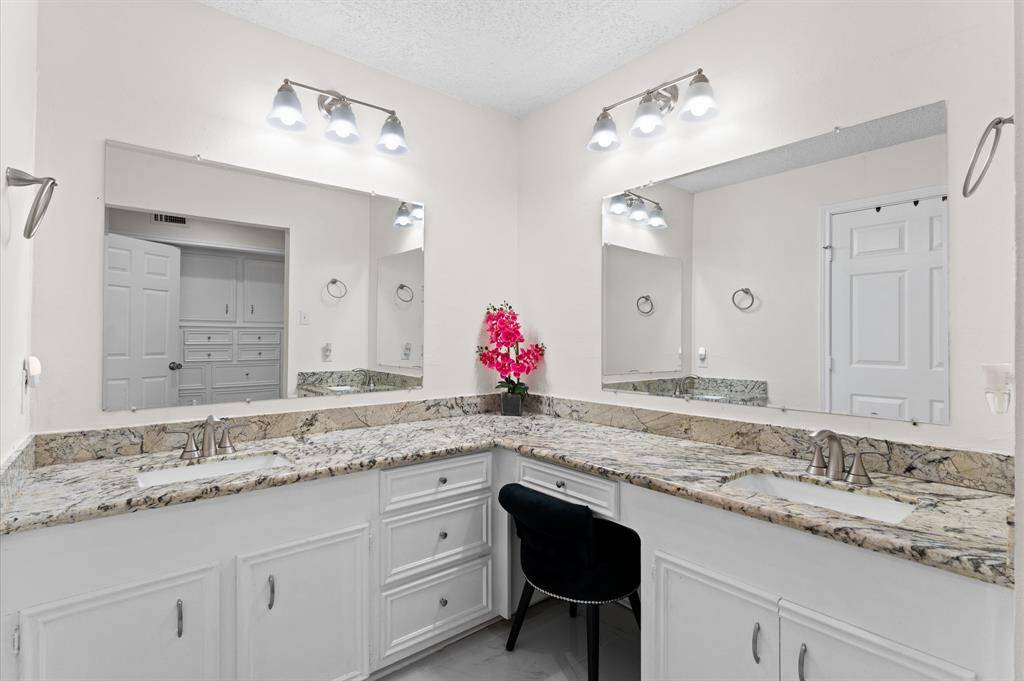 Two sinks are better than one in this convenient shared bathroom. Simply beauty, glamour and function.