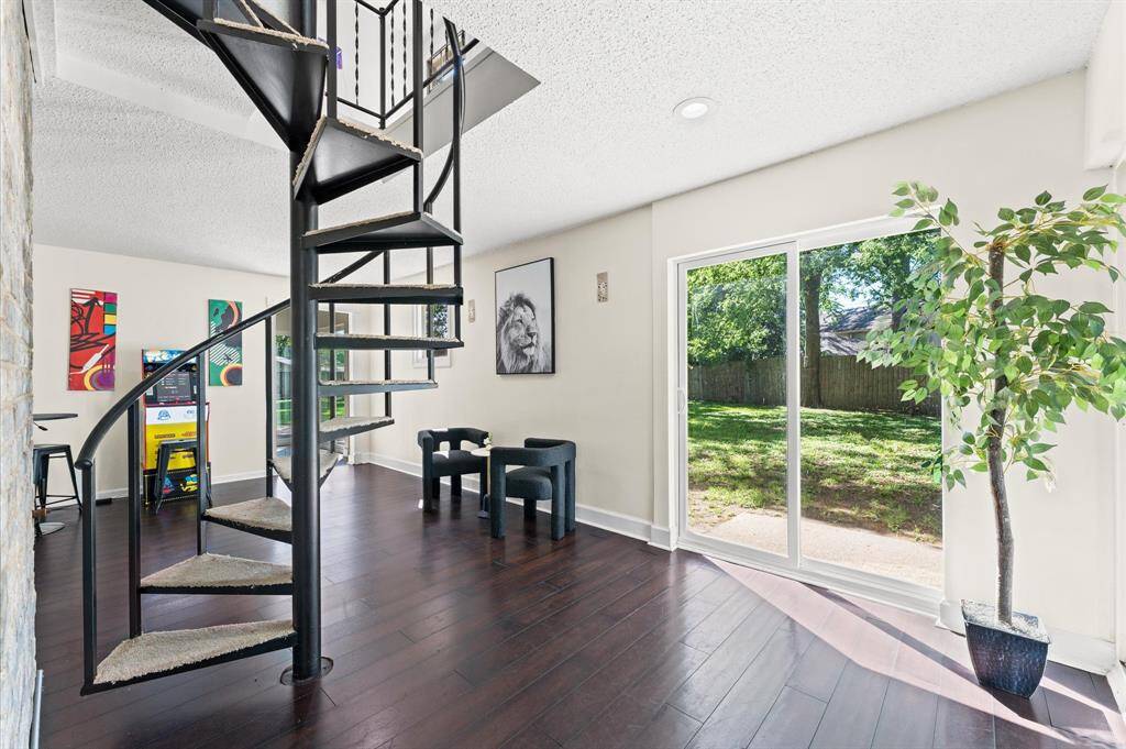 Another look at the Spiral staircase with the wrought iron - atmosphere for charm! Absolutely stunning.  By the way, this home comes with two stairs