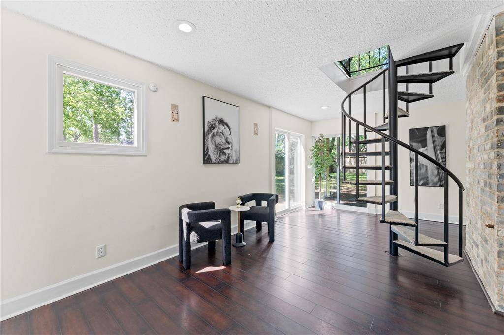 The captivating spiral staircase make a statement of distinction.