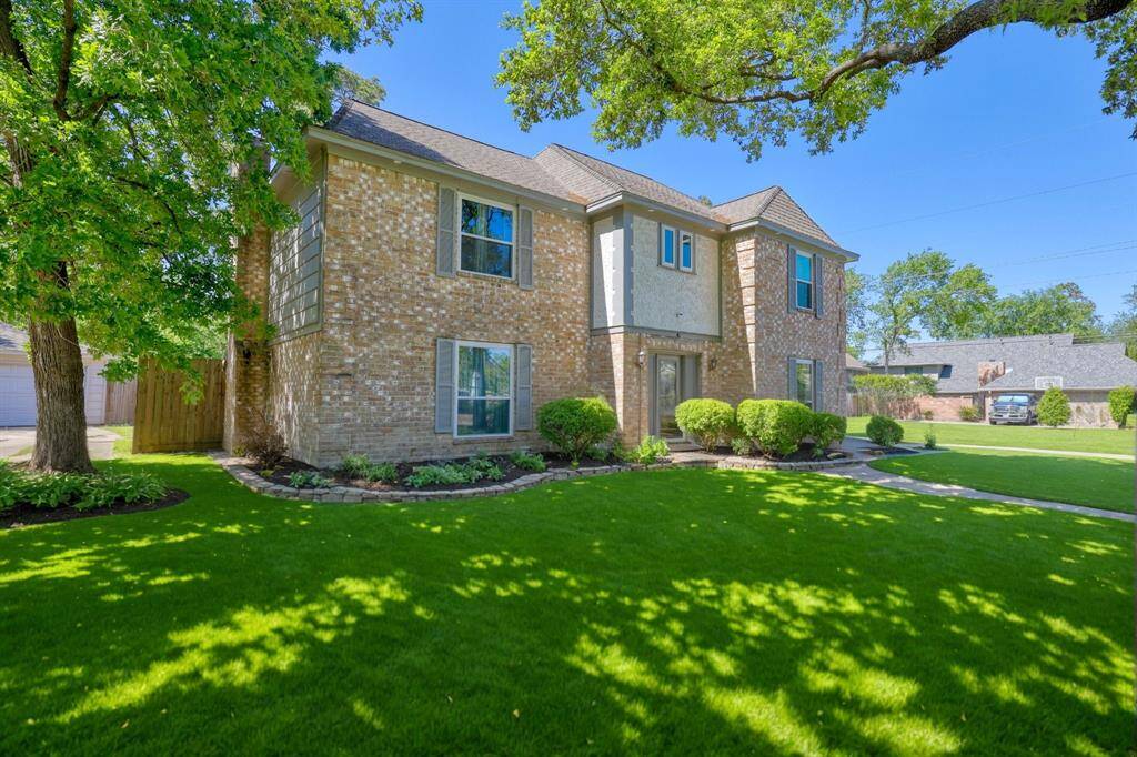 Welcome home to 6814 Chancellor Drive – featuring great curb appeal, a spacious front yard, and a warm, inviting exterior.