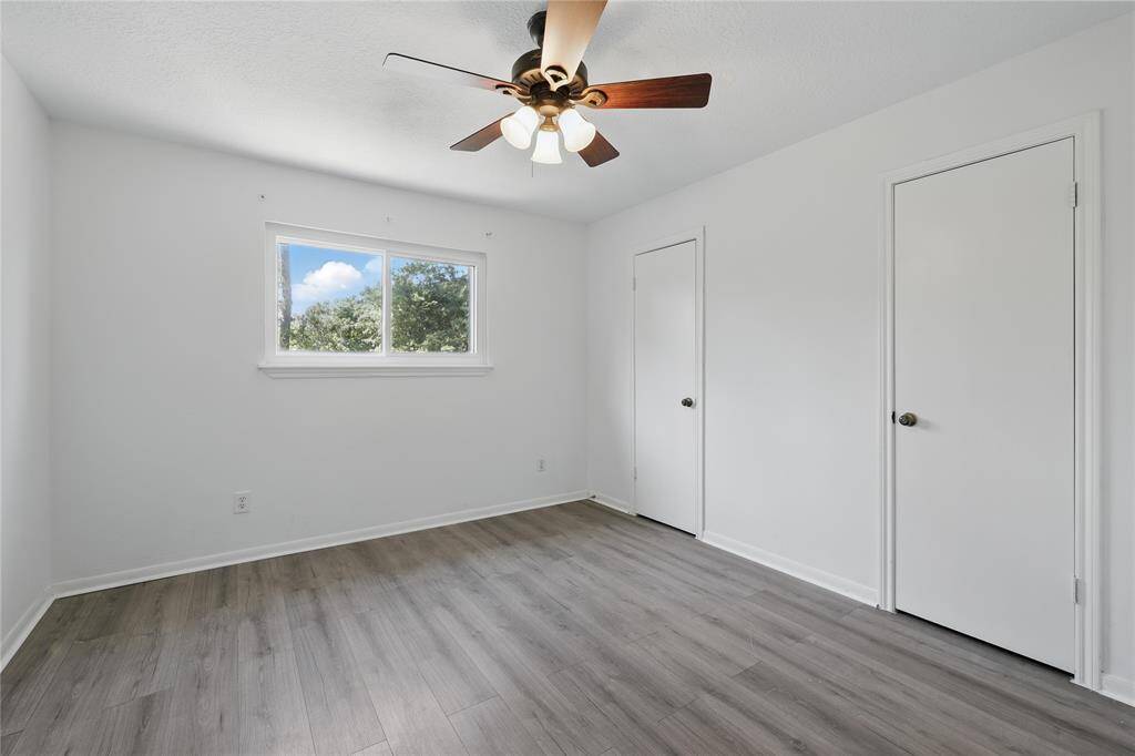 This second secondary bedroom, located on the second level, offers a peaceful retreat with plenty of space and natural light.