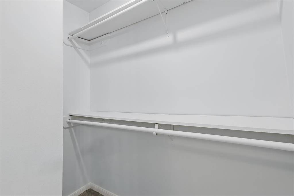 The walk-in closet offers ample space, providing plenty of room for all your wardrobe needs while keeping everything neatly organized.