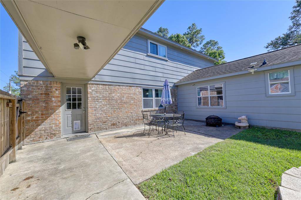 Check out this patio area, offering endless possibilities for entertaining guests!Whether you're grilling up a delicious meal, enjoying a cozy fire, or roasting s'mores under the stars, this outdoor space is perfect for making lasting memories.