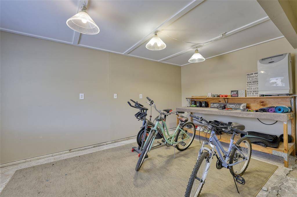 This unfinished garage space offers endless potential—perfect for converting into a home gym, a quiet office, or even a workshop area.The flexible layout allows you to tailor the space to fit your lifestyle and needs.