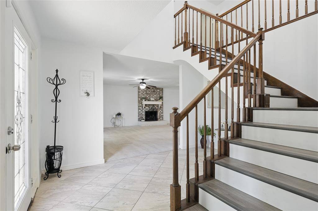 Step into a foyer that immediately sets the tone for the home’s vibrant and welcoming atmosphere.Soaring ceilings, abundant natural light, and an effortless transition into the main living areas make this entryway both elegant and inviting. Whether you're welcoming guests or returning after a long day, the space radiates warmth and style—offering a glimpse into the thoughtful design and comfort found throughout the rest of the home.
