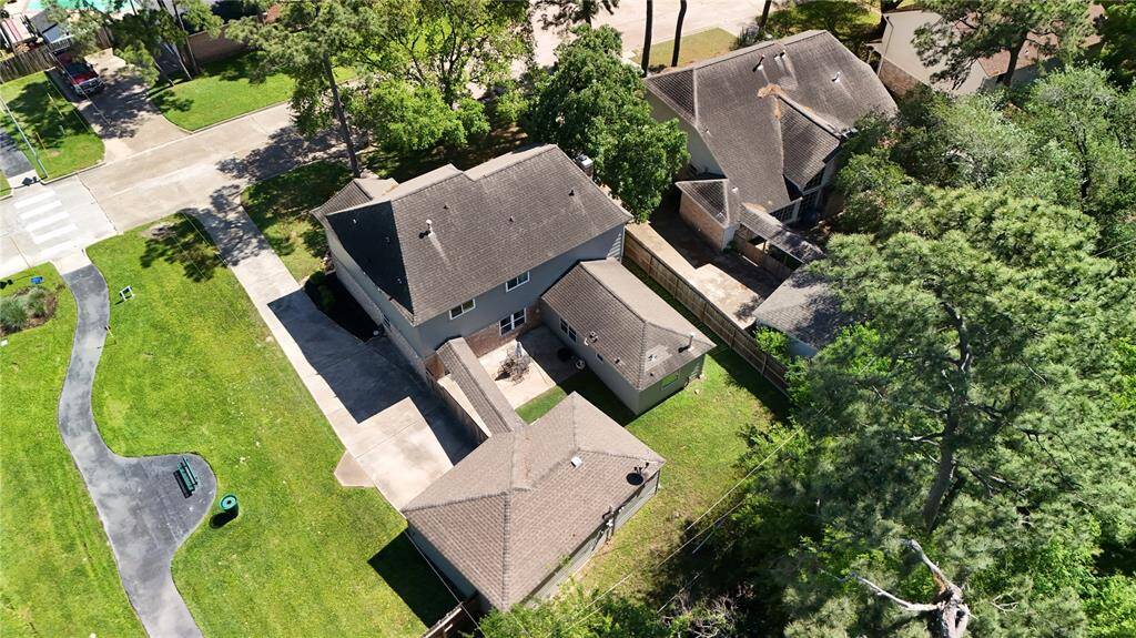 Aerial drone shot capturing the entire property, offering a clear view of the home, surrounding landscape, and overall layout—perfect for understanding the full scope and space of the property.
