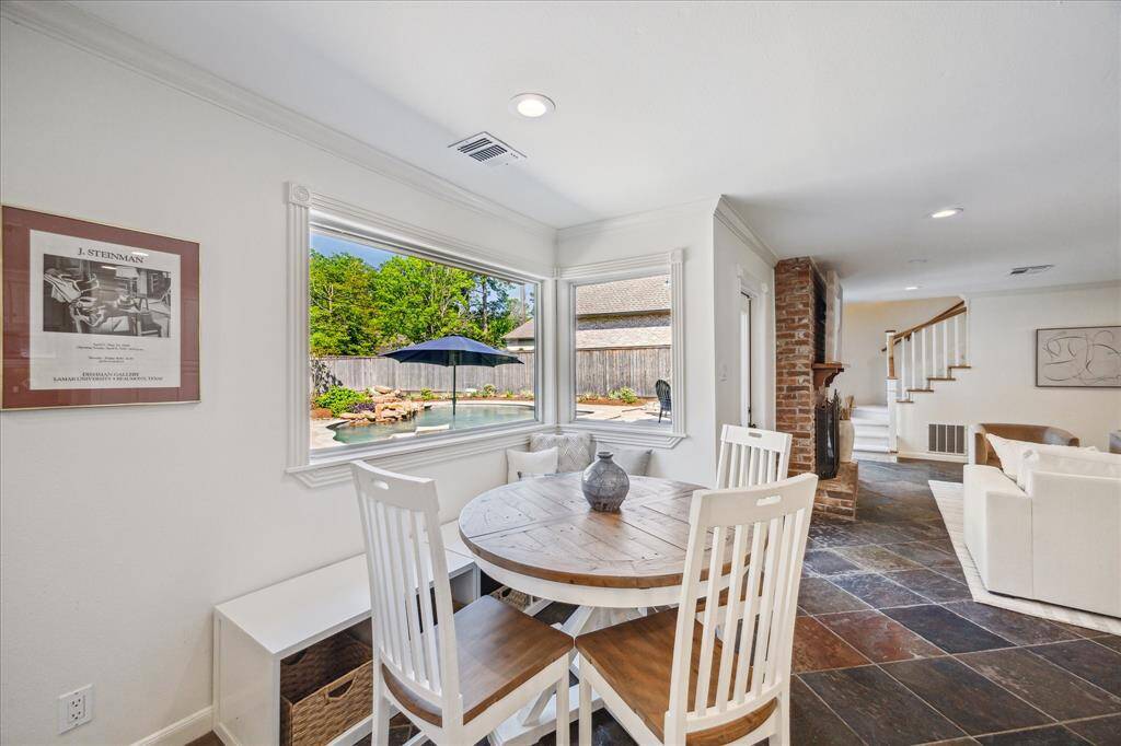 Charming breakfast nook overlooking the sparkling pool is such a great way to spend day!