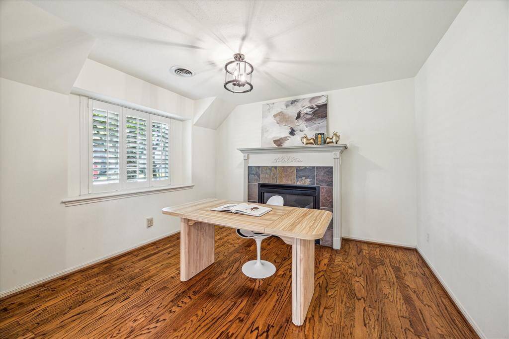 A secluded private study, complete with a gas log fireplace, offers a cozy retreat.