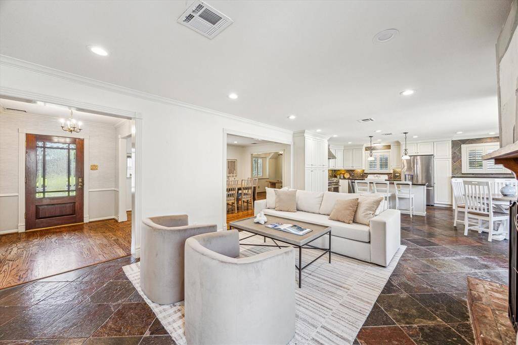 Here's another view of the family room, highlighting the inviting openness of the home while still offering well-defined spaces.