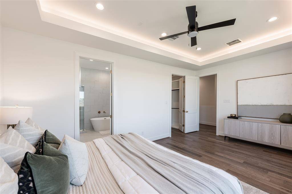 Designed with serenity in mind, this primary suite is a refined yet relaxing escape.