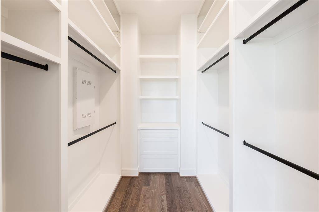 A boutique-style walk-in closet with custom built-ins for effortless organization.