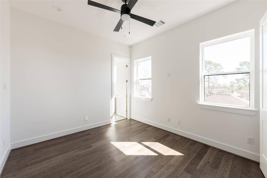 The continuity of engineered flooring and level 5 walls extends throughout, maintaining a refined aesthetic.