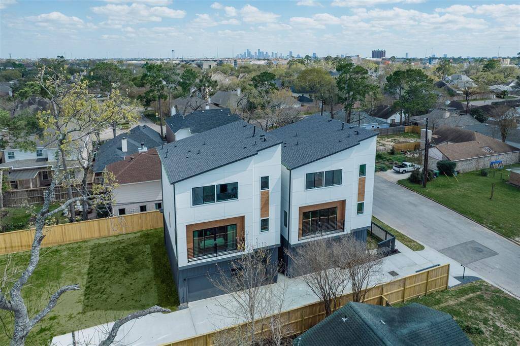 Modern homes with sleek facades line the quiet, well-planned streets of this exclusive neighborhood.