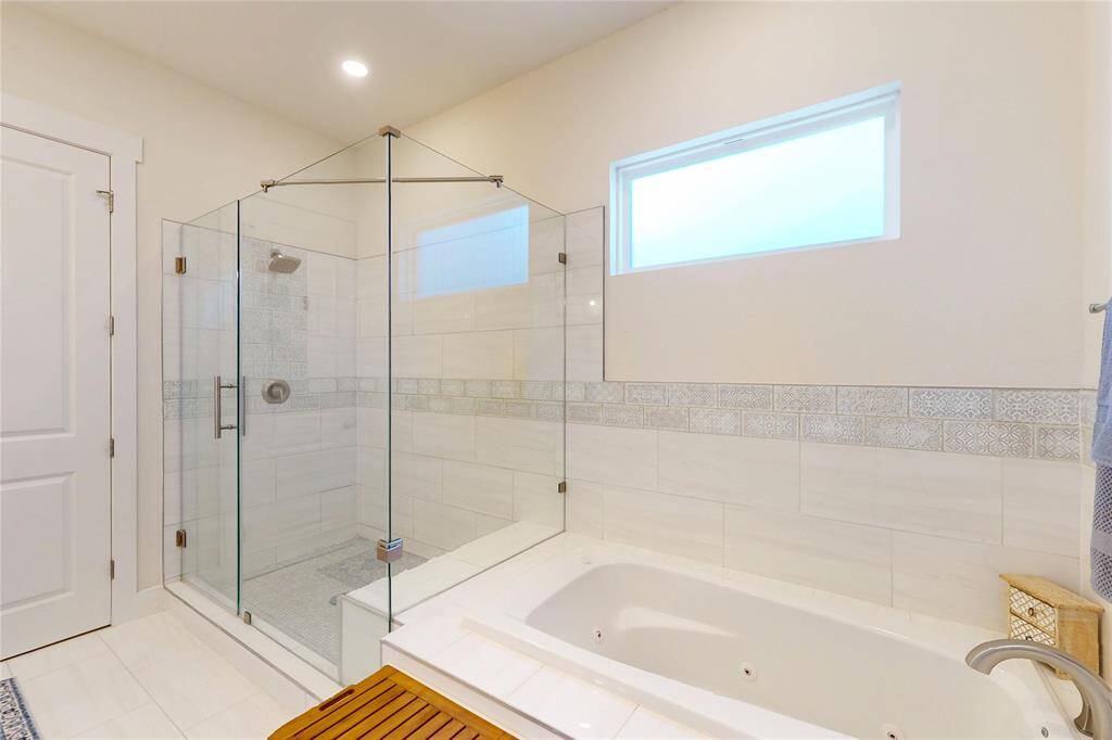Walk in shower and soaking tub in this primary bathroom.