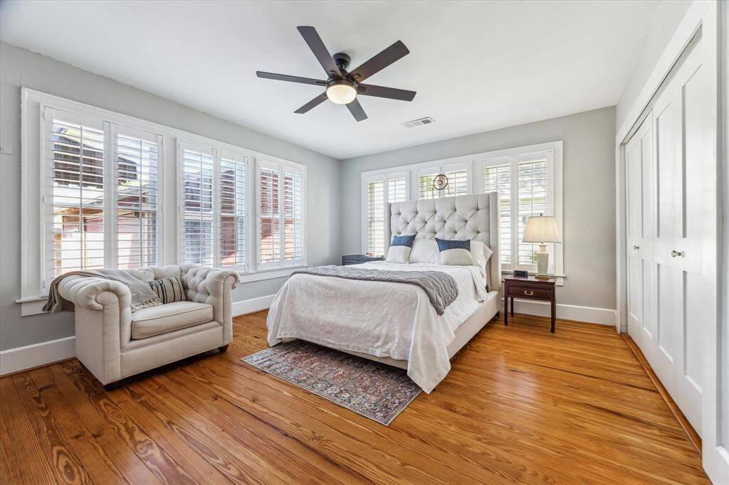 Comfortable and serene, the primary bedroom includes a cedar-lined closet with Elfa shelving for smart organization.