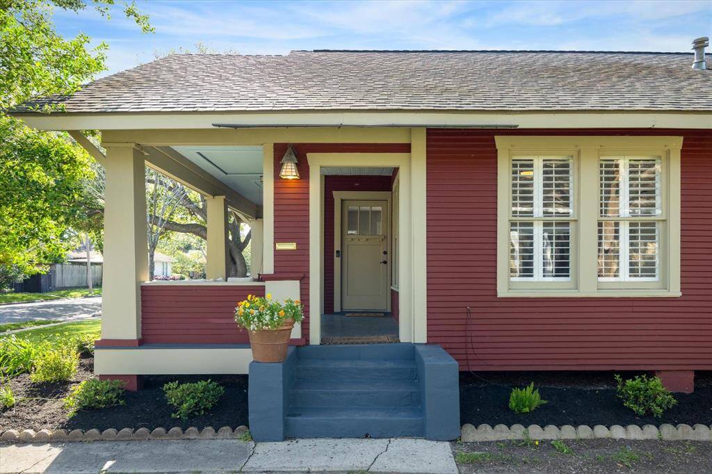 This beautifully maintained home features a welcoming front porch.