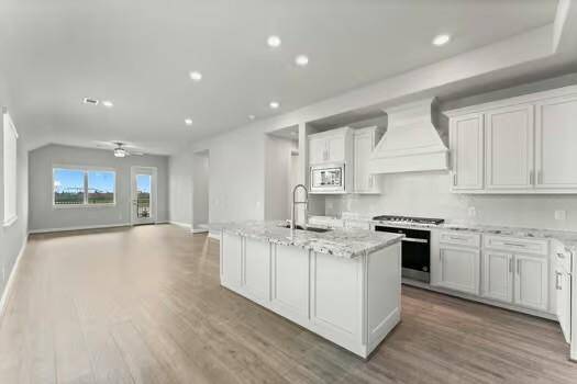 Spacious open-concept kitchen and living area.