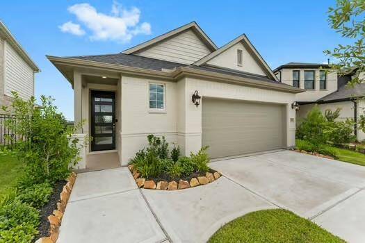 Sleek entry and tasteful landscaping, offering excellent curb appeal in a desirable neighborhood.