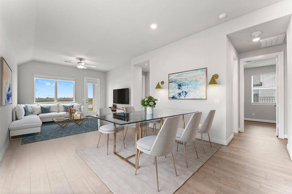 Bright, modern open-concept living and dining area features a spacious layout with large windows, light wood flooring, and neutral tones.