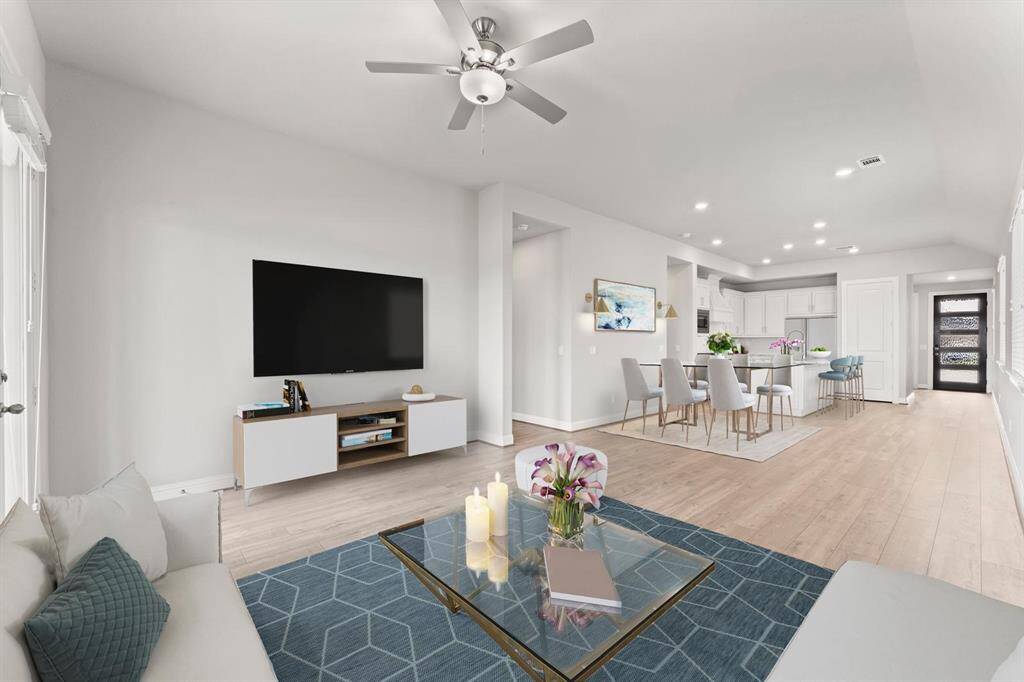 Spacious, open-concept living area with a modern but cozy atmosphere.