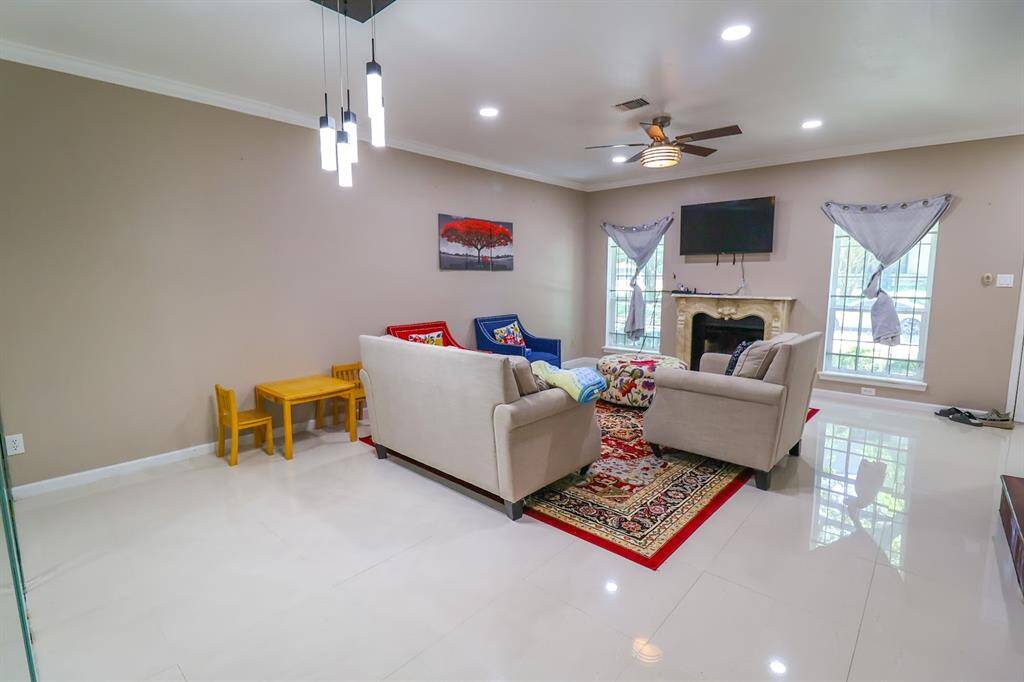 Spacious living room/family room with wood-burning fireplace.