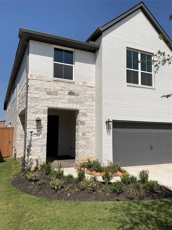 Stylish modern home with sleek design and inviting curb appeal.