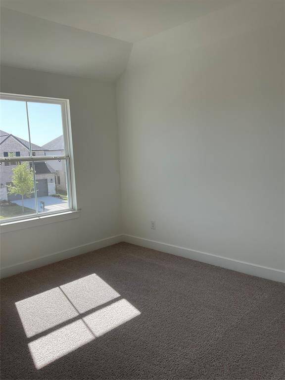 Upstairs, a bright fourth bedroom offers the perfect space for guests or a home office.