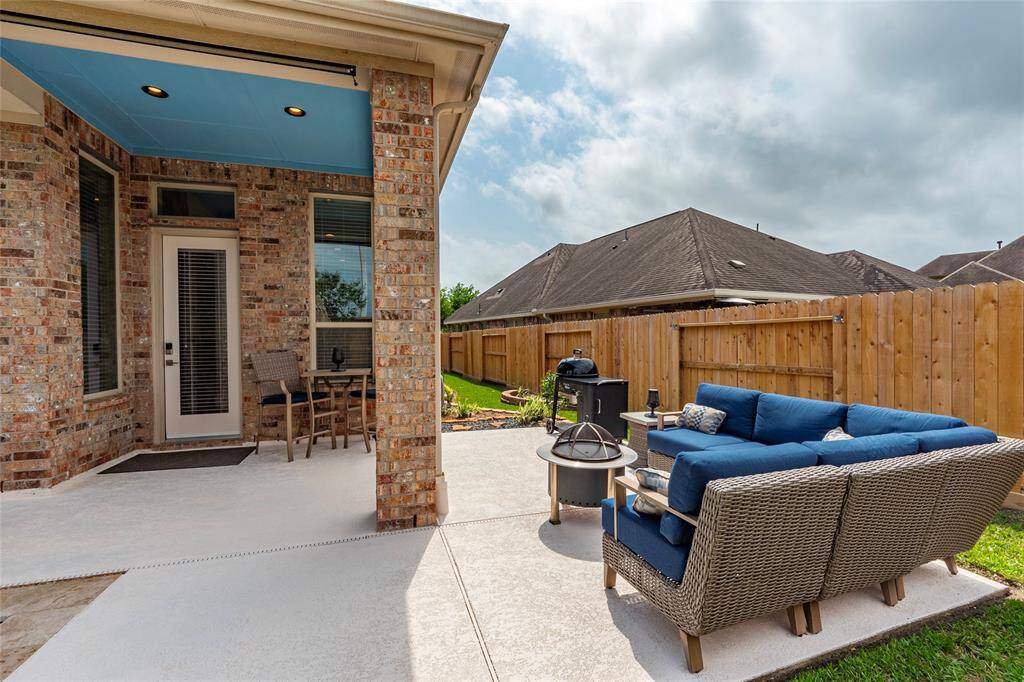 Spacious backyard patio and extensive comfortable outdoor seating area provides amble space for outdoor entertaining.