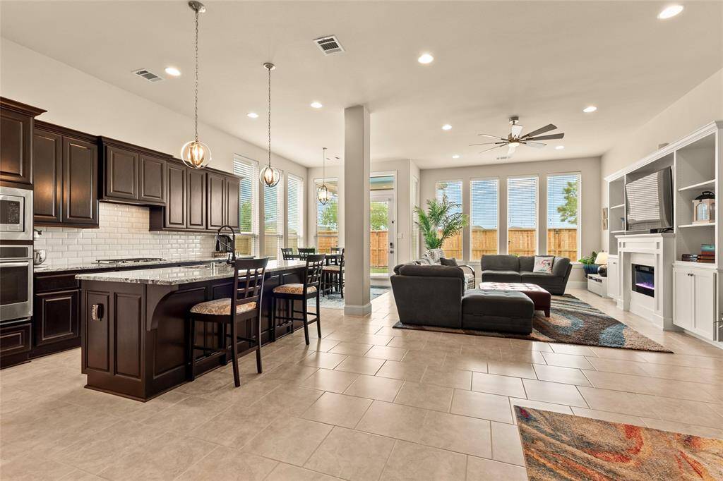 Updated interior lighting & fixtures throughout with dimmable features enhancing the beauty of the home. Wall-of-windows in the open concept living areas provide an abundance of natural light.